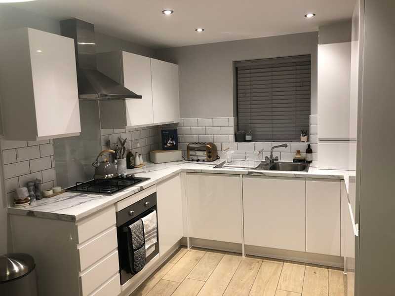 A newly decorated kitchen with new windows and doors